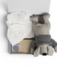 newborn baby hamper with white body suit and alive products and fluffy dog. Australia Wide delivery