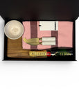 Housewarming gift box featuring a Moët & Chandon mini champagne, handcrafted ceramic dish, marble-handled cheese knives, solid cheese board and Hommey tea towel.