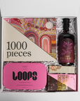 curated relaxation gift box with 1000 piece puzzle, lost phoenix farm gin, loops masks and drinking chocolate