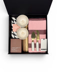 The Artisan Housewarming Gift Box featuring two handcrafted ceramic dishes, solid cheese board, marble-handled cheese knives, Hommey tea towel, Ecosoy hand-poured candle and Koko Black chocolate