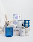 A great baby boy gift idea with perfume for mum, bunny rattle, yummy chocolate, insulated coffee cup and candle all beautifully gift wrapped