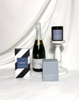 Pol Roger champagne all occasion celebration gift. Beautiful blue toned gift box containing an Ecosoy candle and koko black chocolate.