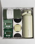Wellness gift box with Ecovask towel, Sage and cooper water bottle, kitsch solid conditioner and shampoo and koko black chocolate