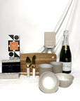 Pol Roger champagne celebration home settlement gift box.  Containing quality handcrafted ceramic dishes, hand printed linen towel, ceramic cups, koko black chocolate and Ecosoy soy candle.  Australia wide delivery