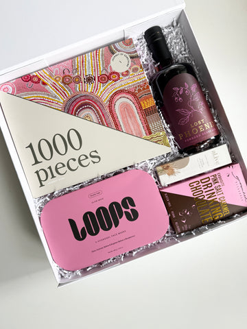 jigsaw puzzle gift in a gift box with lost phoenix farm gin, drinking chocolate, loops face masks and alive lip butter