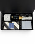 Luxury blue-toned gift box featuring Pol Roger Champagne, Koko Black artisan chocolate and an Ecosoy hand-poured candle. 