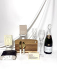 Pol Roger champagne celebration home settlement gift box.  Curated selection of cheese knives, wooden board, soap, hand printed linen tea towel, Loco Love chocolate and Ecosoy soy candle.  Australia wide delivery.