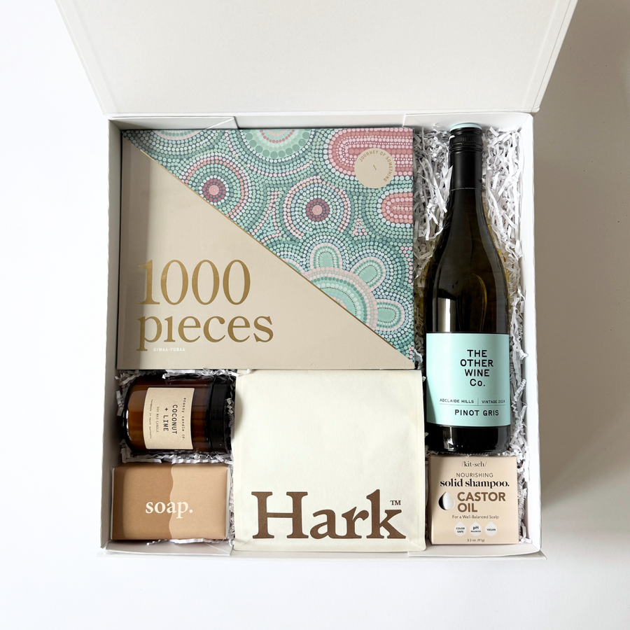 a unisex get well or wellness gift for any occasion.  Contains a 1000 piece puzzle wine, kitsch solid shampoo, coffee beans from hark, hand poured soy candle and commonfolk soap